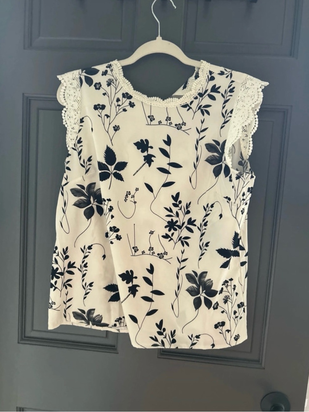 Sleeveless Lace-Trim Floral Print Blouse — White with Black Botanical Pattern